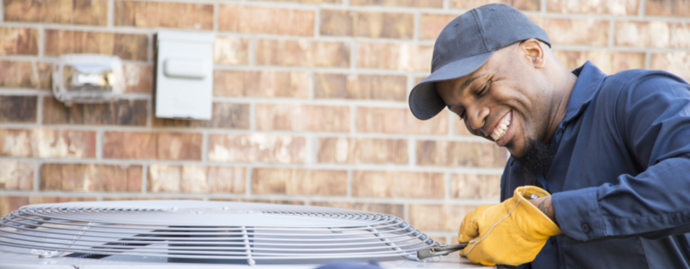 man fixing ac