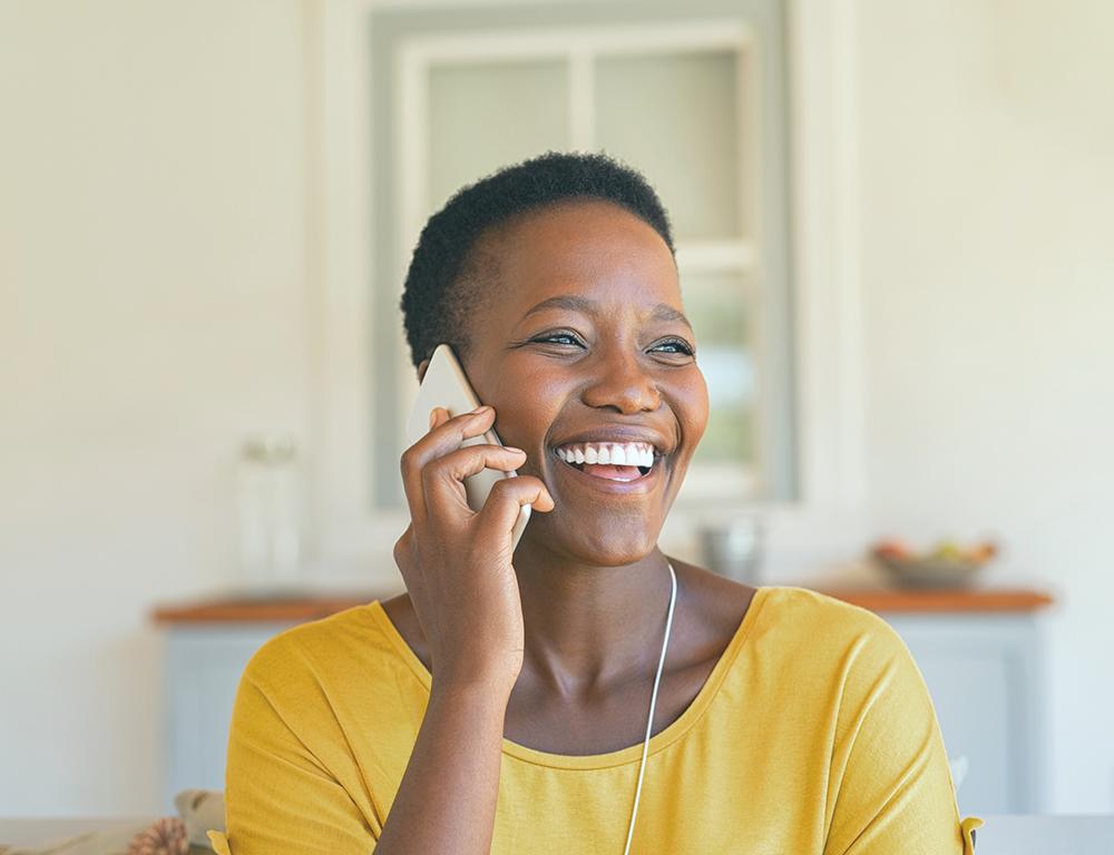 woman smiling on phone